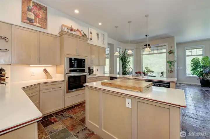 Well-appointed kitchen with Corian countertops, stainless steel appliances, pantry, and updated lighting.Well-appointed kitchen with Corian countertops, stainless steel appliances, pantry, and updated lighting.