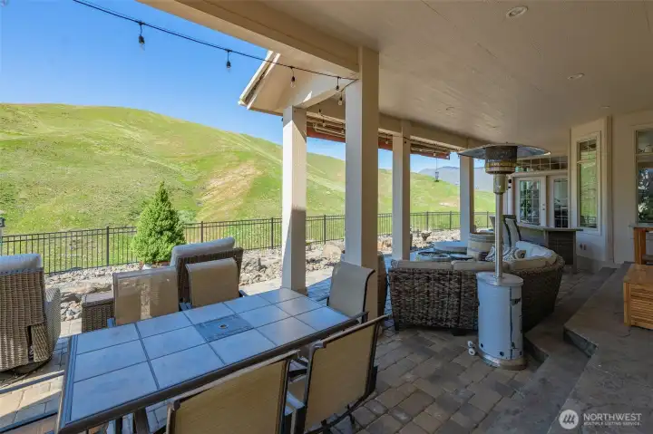 Stamped concrete and paver patios with party lighting create the ultimate entertaining environment.