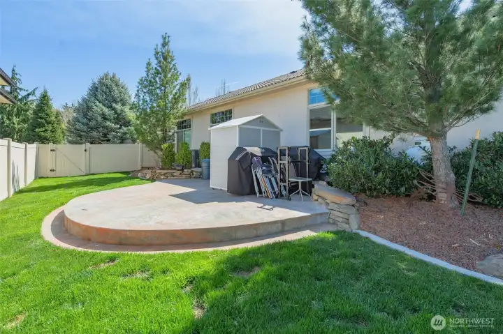 Over $130,000 in professional landscaping featuring garden beds, including strawberries and zucchini.