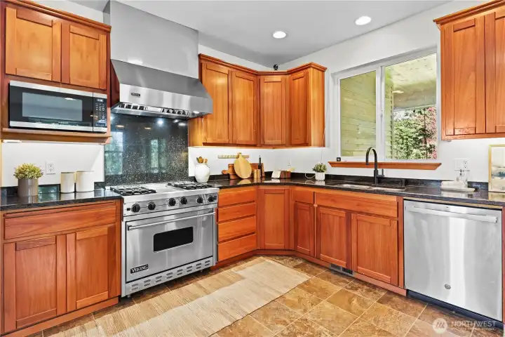 gourmet kitchen with granite countertops and wolf stove/oven