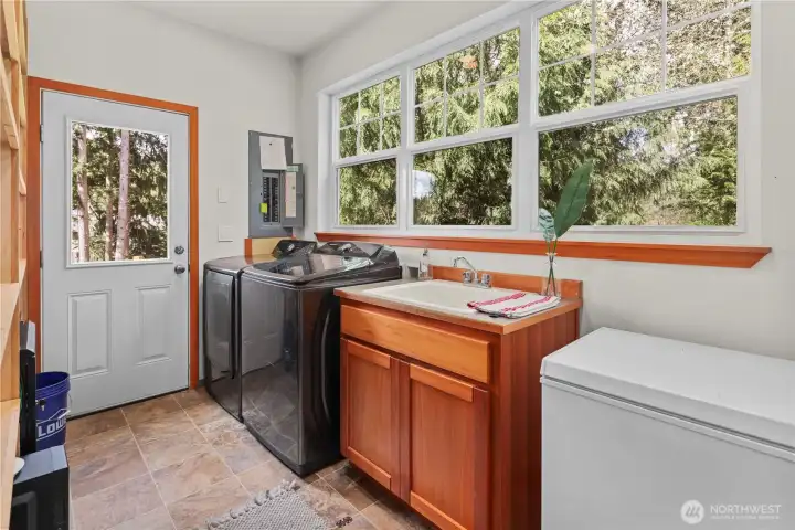 extra large laundry and pantry area with access to back garden area