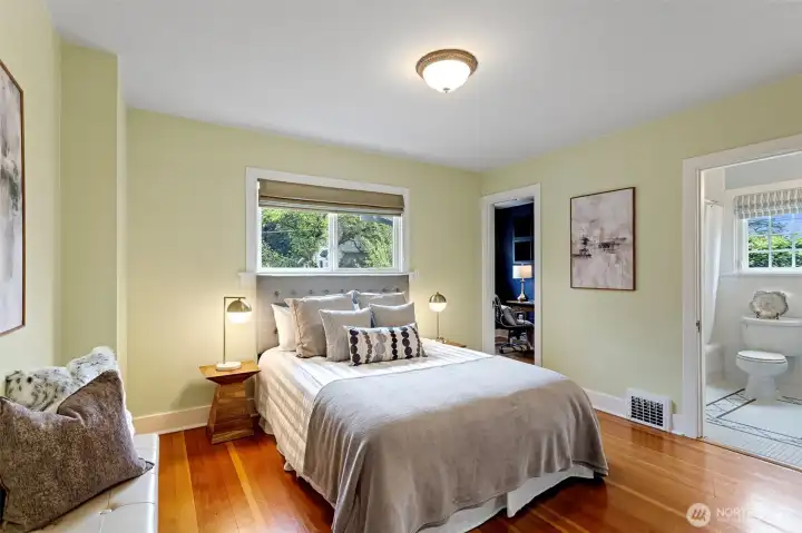 One room, three glimpses — bedroom, flex space, bath. The circular floor plan isn't an abstraction. This is what it looks like.