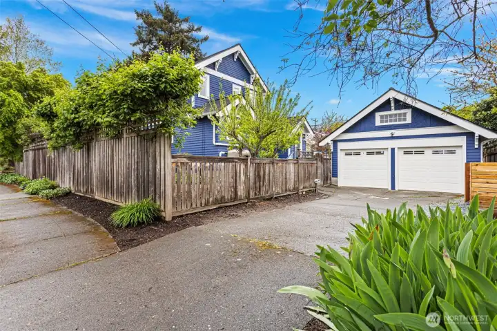Two-car garage, concrete driveway, sub-panel, 240V outlet, Level 2 EV charger-ready, pull-down ladder to a large attic with real headroom. The parking situation is solved. (The attic is a conversation for another day.)
