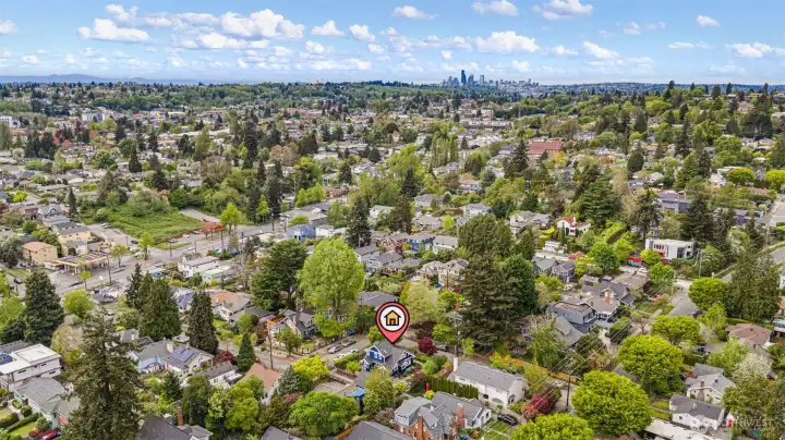 Seattle skyline, Olympic Mountains, established neighborhood canopy. Twenty-three minutes to downtown by car. The city is right there — and so is the quiet.