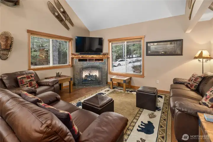 Just to left of the front door you see this charming living room w/ a gas fireplace for those cold winter days.
