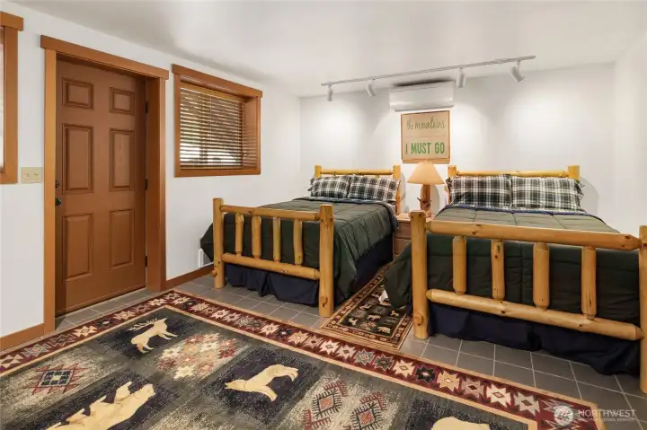 Downstairs is a large room used for extra sleeping. You can easily have several beds in this large area.