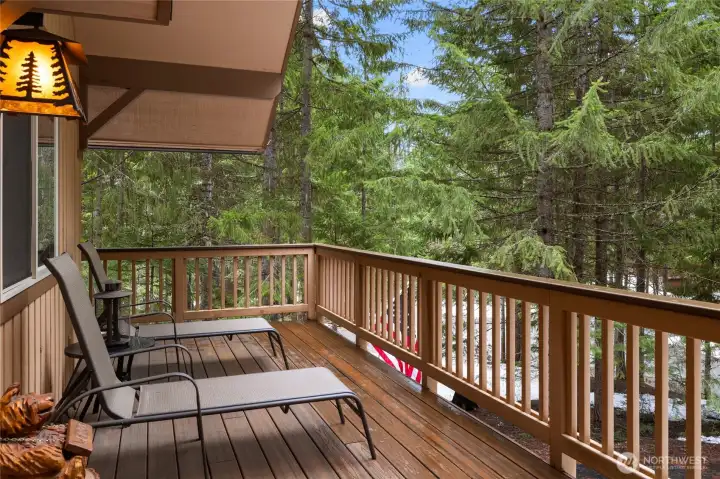 Large deck to enjoy time outside taking in the beautiful trees, trails and lake.
