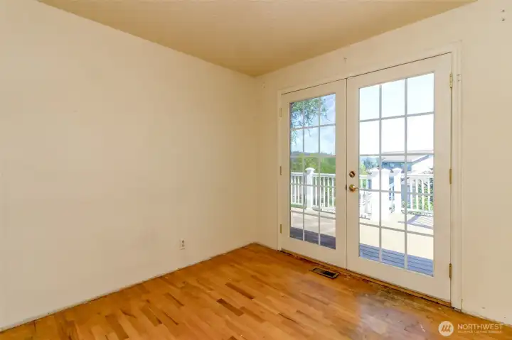 Main floor dining room w/French doors to deck