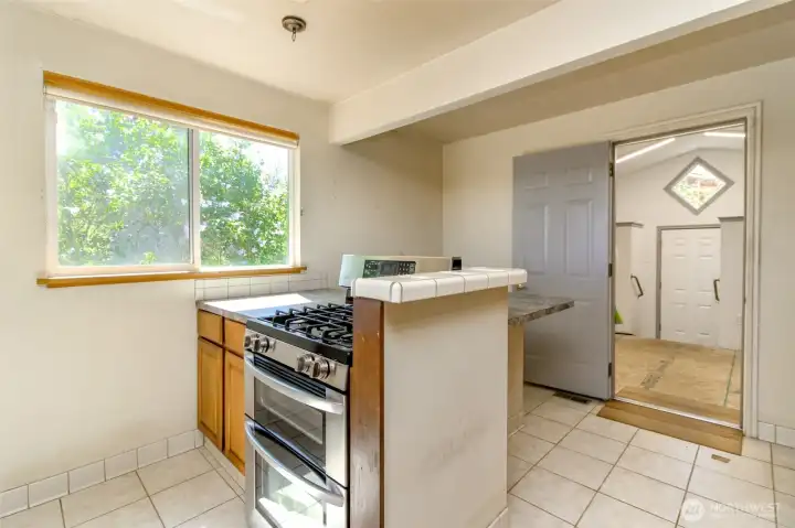 Kitchen eating bar, entrance to utility room