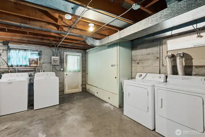 Lower level basement is shared area with laundry and storage.
