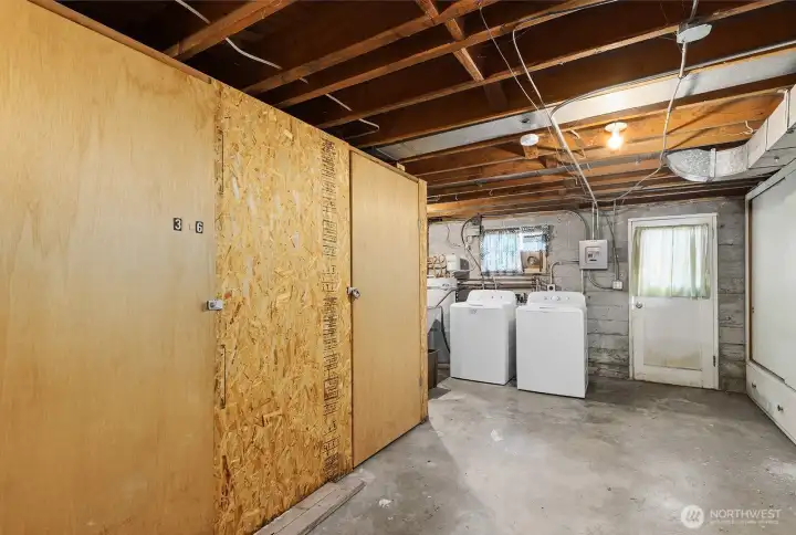 Lower level basement shared area with laundry and storage.
