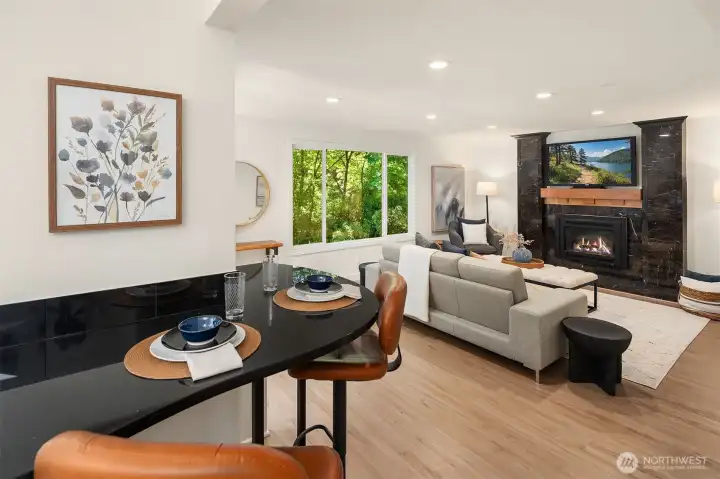 Convenient breakfast bar extends into the adjacent family room.