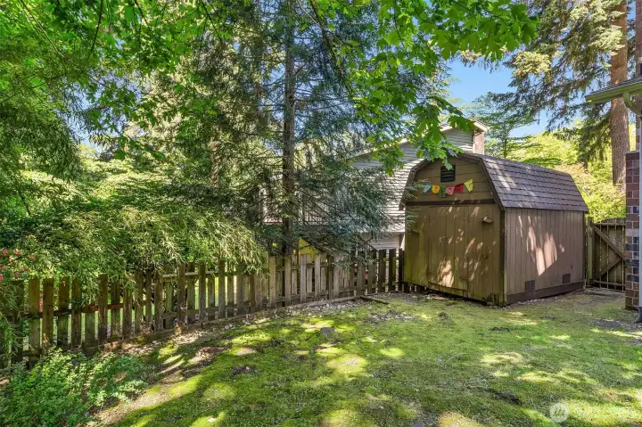 Gardeners will appreciate the storage shed.