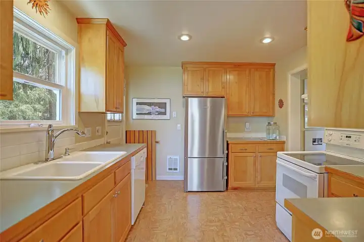 Updated kitchen with custom cabinets made by local woodworker w/ locally cut & milled Alder.