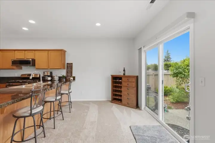 Dining Area Extends To Fenced Backyard Patio