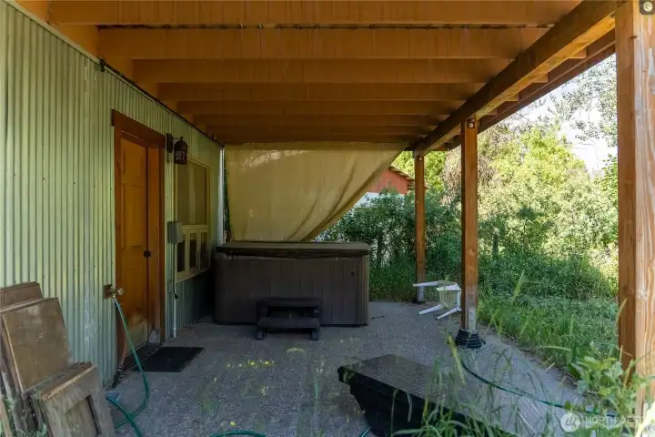 Back patio and hot tub just off the bonus room. Back patio and hot tub just off the bonus room.