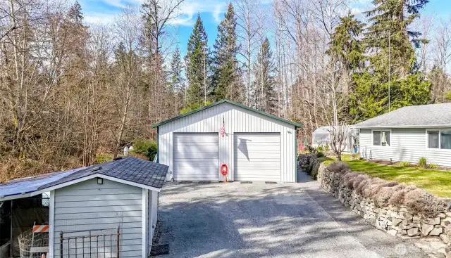 Well house to left and 1,200SF garage with 14' door and abundant storage.  Let's take a look....