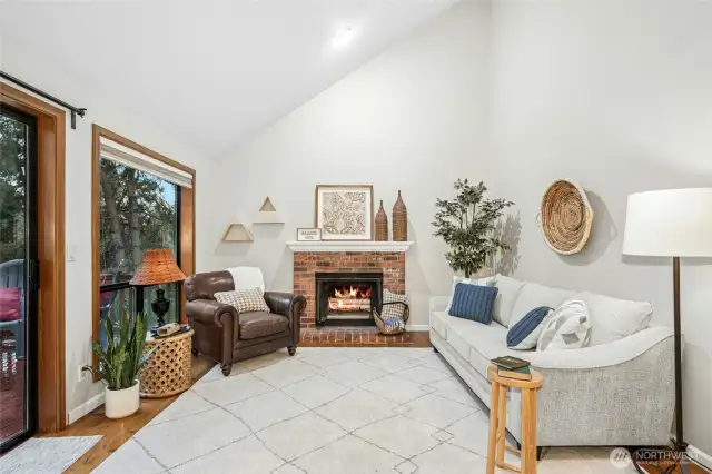 Great room filled with natural light and a cozy wood-burning fireplace or cool off this summer with A/C.