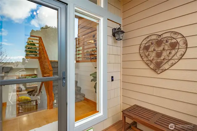 Close up view of front entrance and new glass door with sliding screen to let that fresh air in .