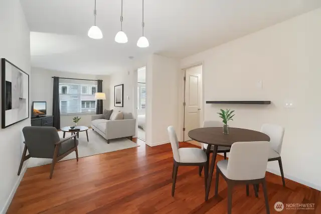 Open concept with beautiful wood floor (Virtually staged)
