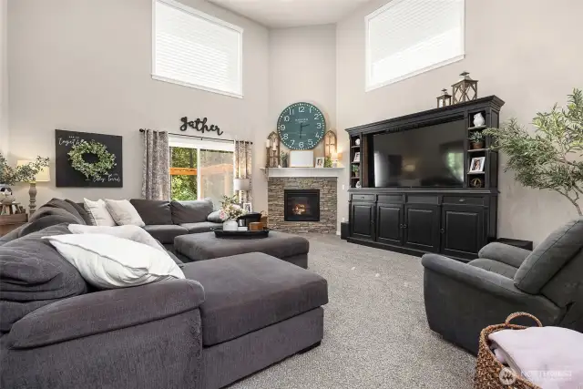 The lodge-inspired great room seamlessly connects the kitchen, living, and dining areas—creating a warm, open space perfect for gatherings and everyday living.