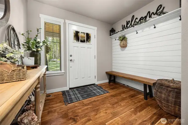 The large foyer includes a charming sitting area, blending function and style as soon as you enter