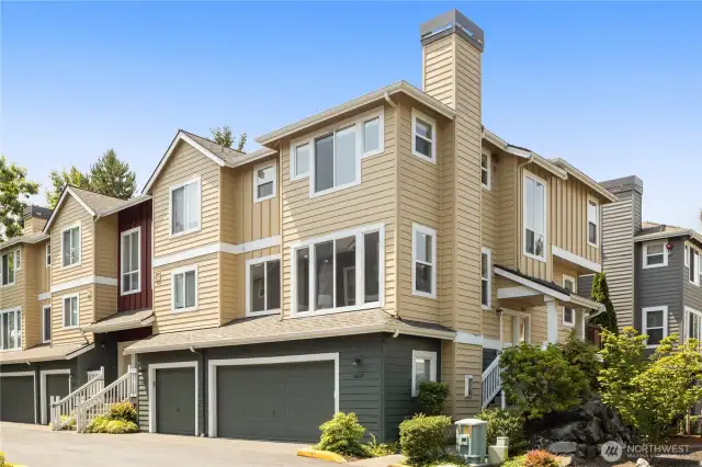 End-Unit Privacy with attached 2-car garage. New carpet, paint, and lighting throughout!