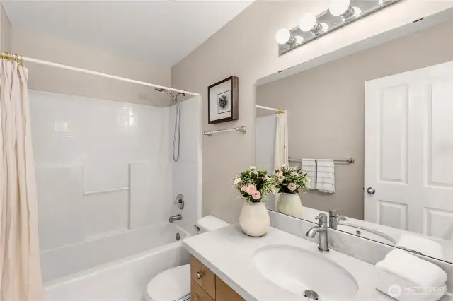 Upper Full BA Updated with quartz counters, new sinks/faucets, and new vinyl flooring