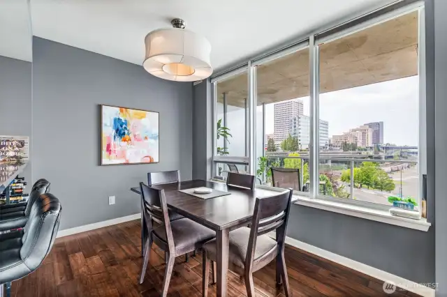 The view from your dining room overlooks your patio and captures the vibrant downtown scene.