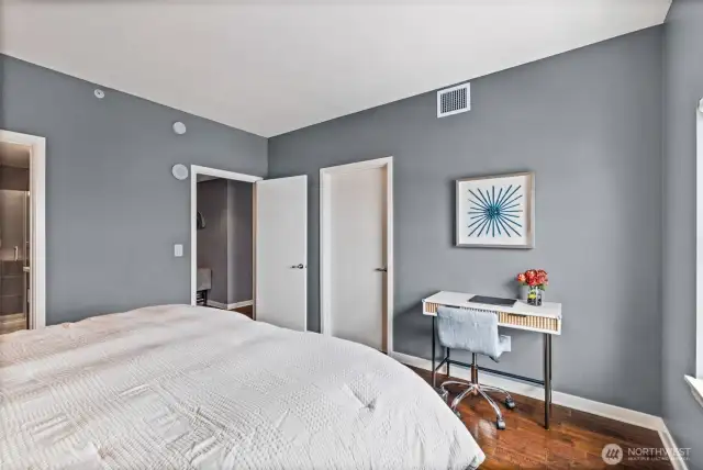 The door shown to left of the desk opens to a customized walk-in closet.