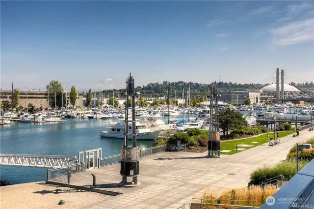 The Esplanade walkway connects several residential and commercial buildings, with designated parks along the way.