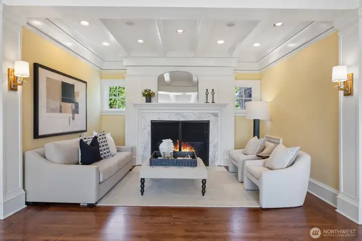 Oversized Statuario marble surround gas fireplace provides additional seating for entertaining or reading your favorite book.