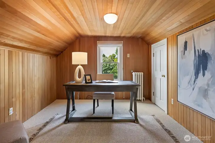 Third floor wood lined office or another bedroom. Two more spaces are on this level. Another bedroom and a large closet or storage area. There is also a ktichenette if you have long term guests or need a spot to keep food and drinks for entertaining.