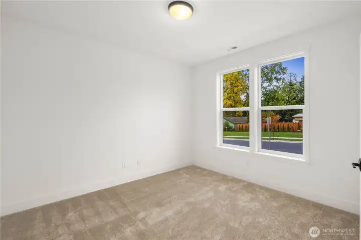 This flexible main-level bedroom, den, or office offers soft carpeting, a peaceful backyard outlook, and easy access to the full bath. Ideal for guests, multigenerational living, or a private home office—whichever best fits your lifestyle.    These photos are from Lot 3 at Gooden Hollow, which is the same floorplan. However, Lot 6 will have changes, so all photos, renderings, site maps, and floorplans are for visualization purposes only. Plans, colors, building orientation, finishes, home outlook, and other details can and WILL vary.