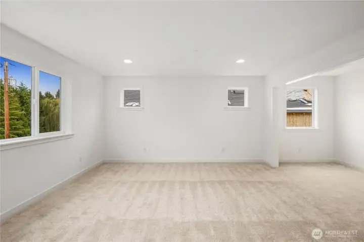 A wide, open layout and tree-lined outlook make this primary suite feel airy and peaceful from the moment you walk in. Soft natural light, plush carpet, and thoughtful separation from the rest of the home create a private haven perfect for relaxation and quiet mornings.These photos are from Lot 3 at Gooden Hollow, which is the same floorplan. However, Lot 6 will have changes, so all photos, renderings, site maps, and floorplans are for visualization purposes only. Plans, colors, building orientation, finishes, home outlook, and other details can and WILL vary.