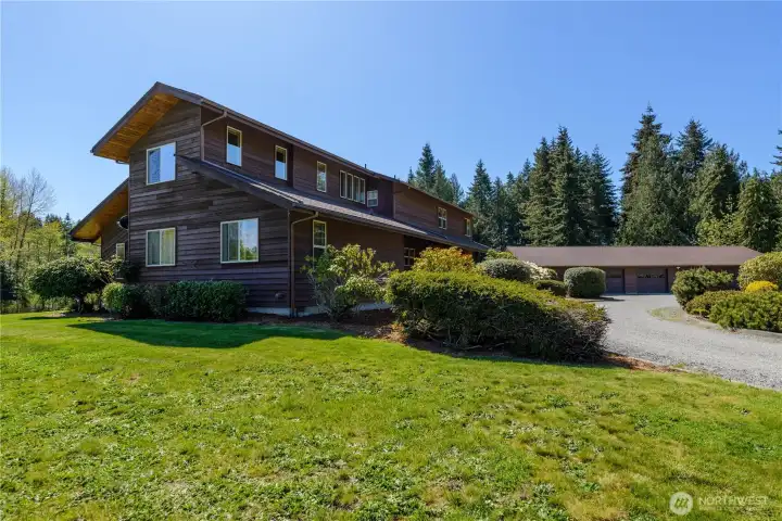 Home features specialty Redwood siding, plus many windows to enjoy the sun and landscape