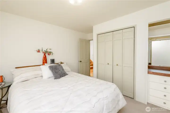 One of the sizable main floor bedrooms with built-in storage