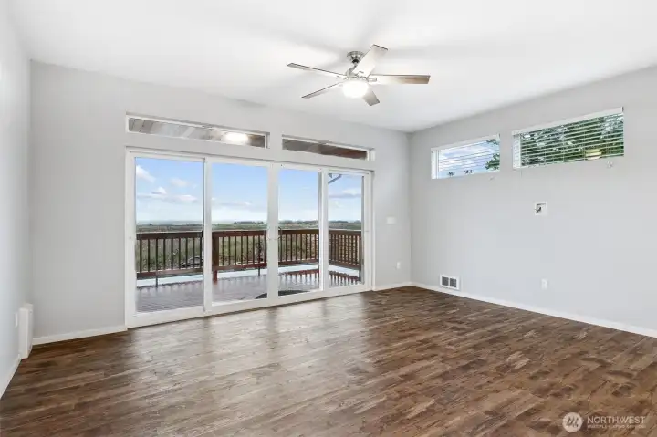 Double slider doors leading to back deck and yard