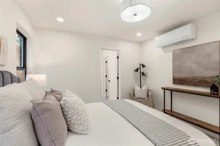 Upstairs primary bedroom connected to full bathroom.