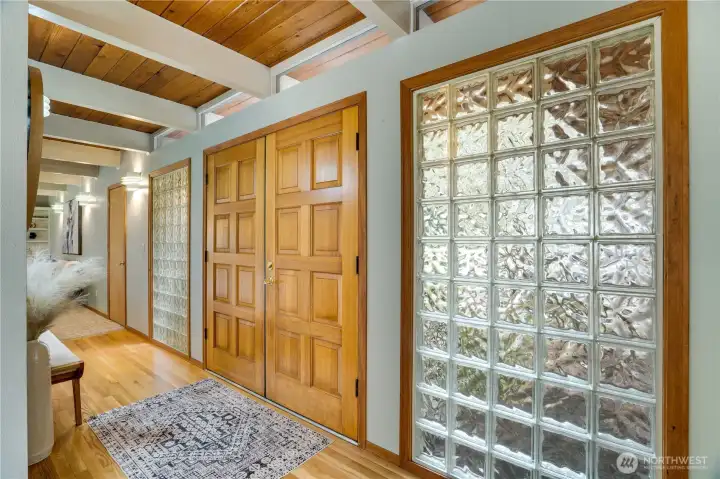 Enter to beautiful woods and architectural delights with beams, transom windows, and glass block to dazzle with natural light.