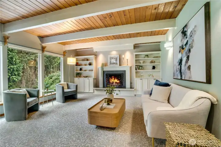 A cozy living room anchored by a fireplace and custom built-ins—perfect for relaxed evenings and effortless entertaining
