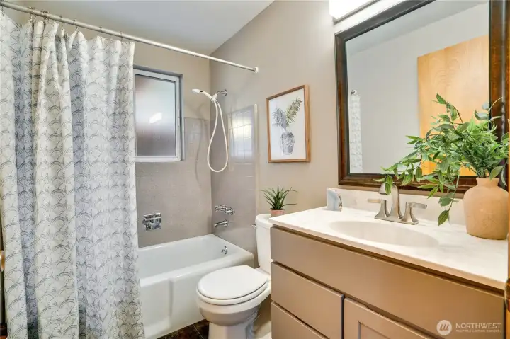 Updated hall bathroom featuring quality finishes and a bright, welcoming feel.
