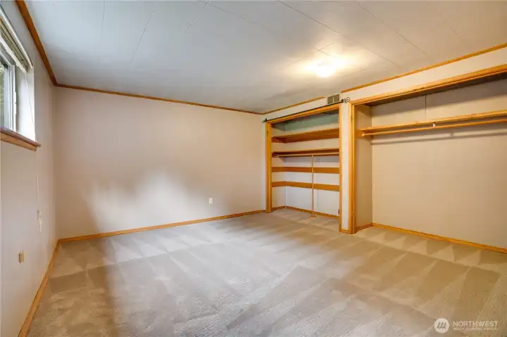 This 4th bedroom is huge with so much storage and closet space.