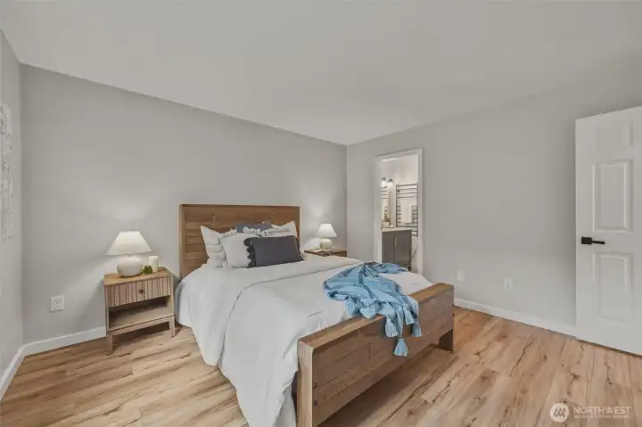 The primary bedroom features an en-suite bathroom and closet with with a built in designed for organization.