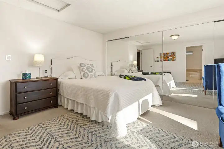 Master bedroom suite with southern exposure, overlooks the greenbelt, has a remodeled full 4 piece bathroom