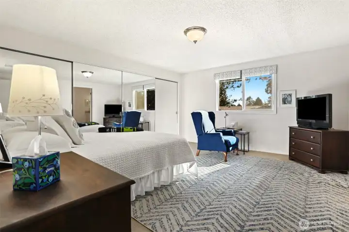 Master bedroom suite with southern exposure, overlooks the greenbelt, has a remodeled full 4 piece bathroom