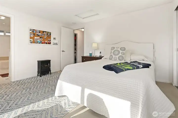 Master bedroom suite with southern exposure, overlooks the greenbelt, has a remodeled full 4 piece bathroom