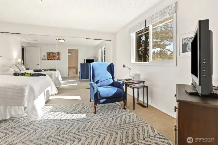 Master bedroom suite with southern exposure, overlooks the greenbelt, has a remodeled full 4 piece bathroom