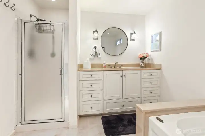 Master bedroom suite with southern exposure, overlooks the greenbelt, has a remodeled full 4 piece bathroom
