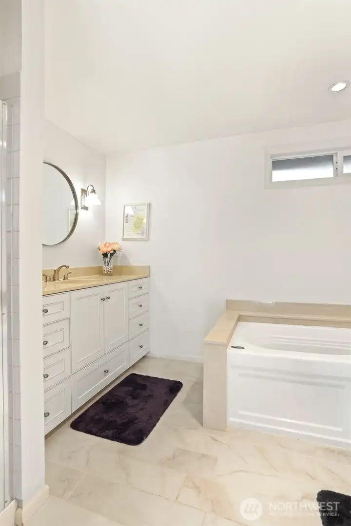 Master bedroom suite with southern exposure, overlooks the greenbelt, has a remodeled full 4 piece bathroom
